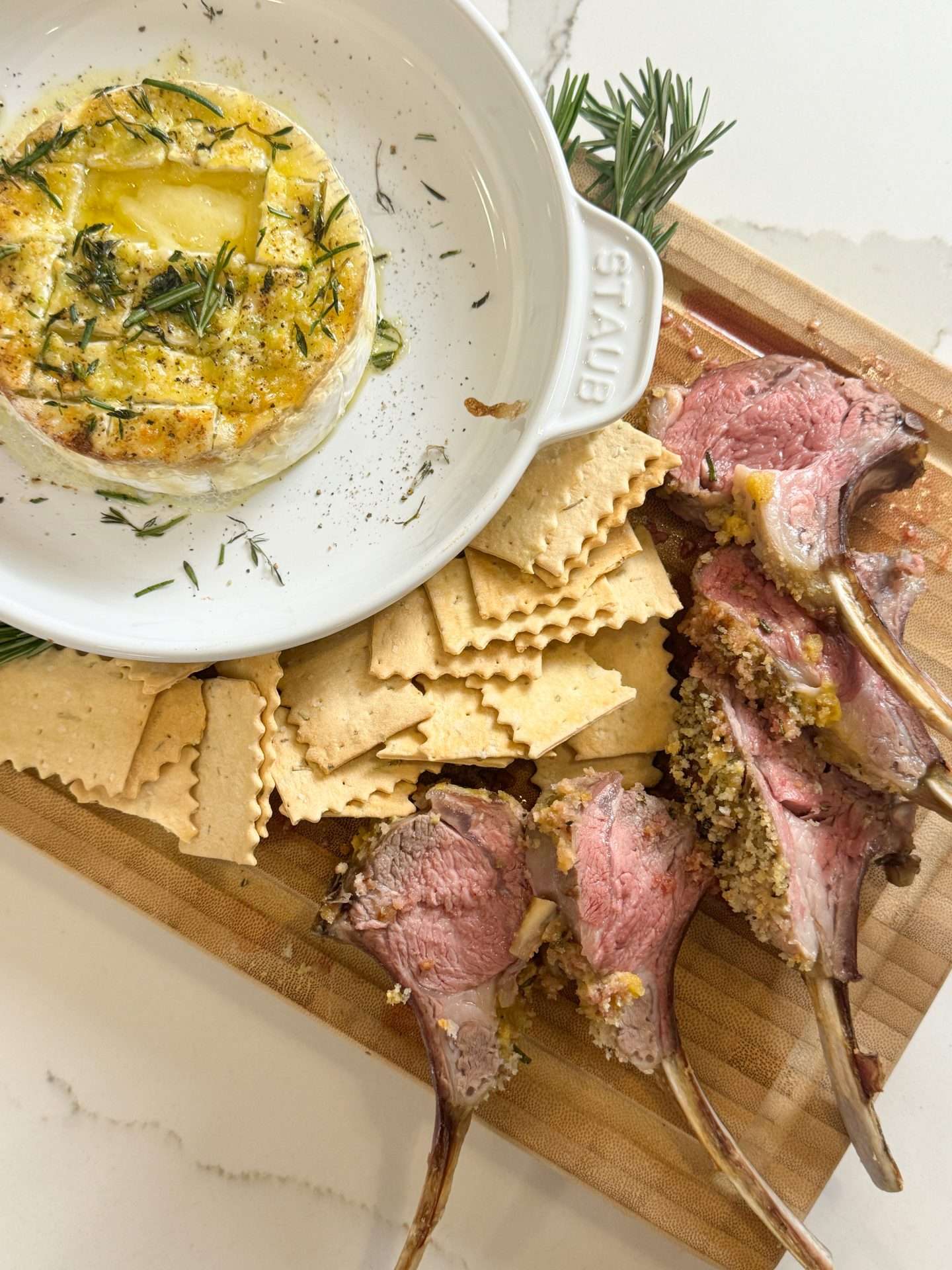 Herb crusted rack of lamb with garlic butter brie