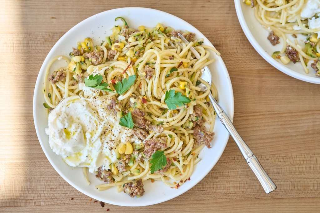 crispy lamb pasta with corn and burrata