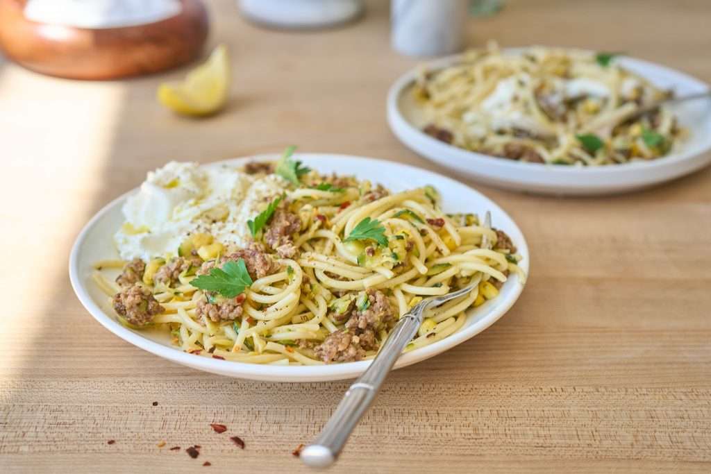 Crispy lamb pasta with corn and burrata