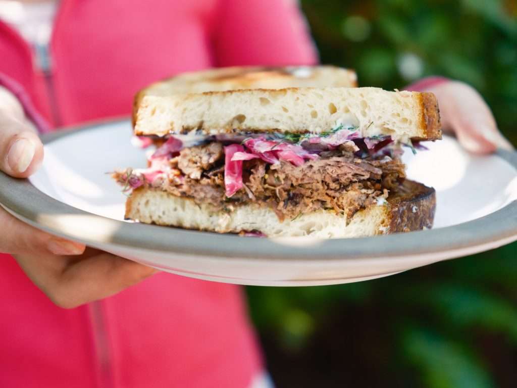 braised lamb and cabbage sandwich