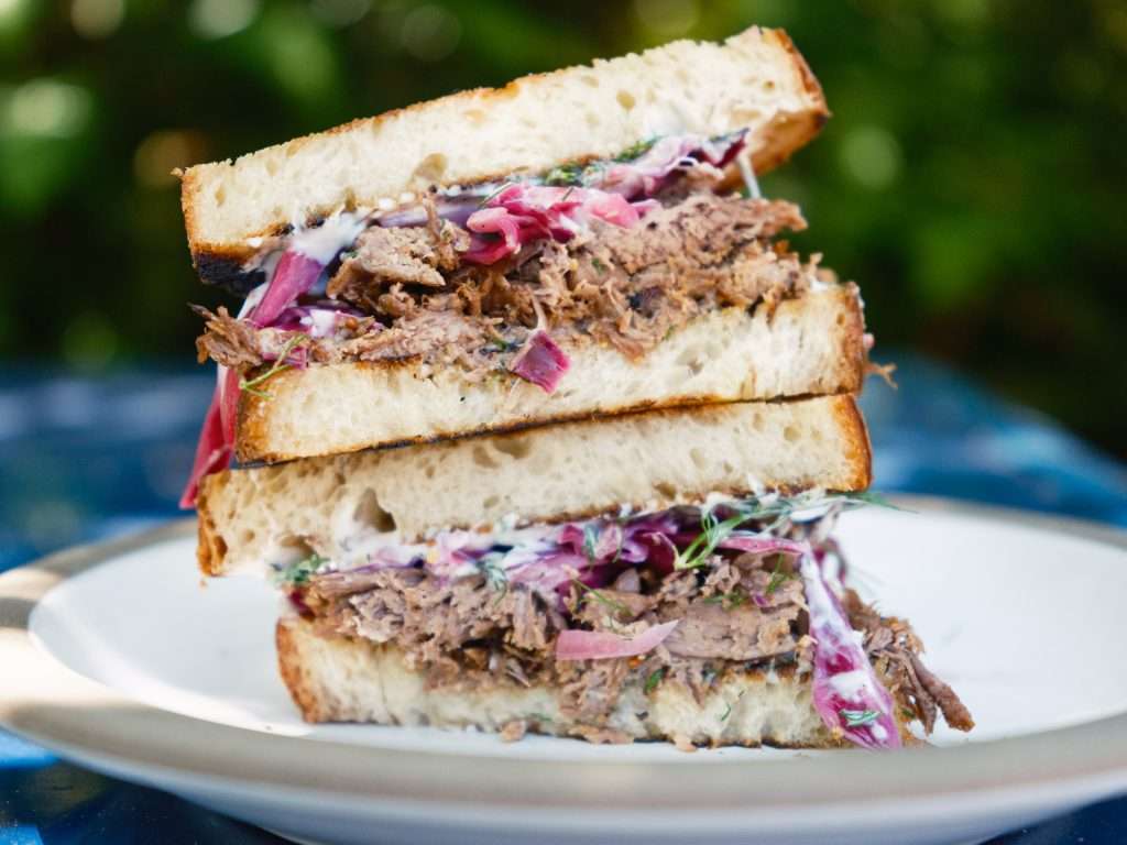 braised lamb and cabbage sandwich