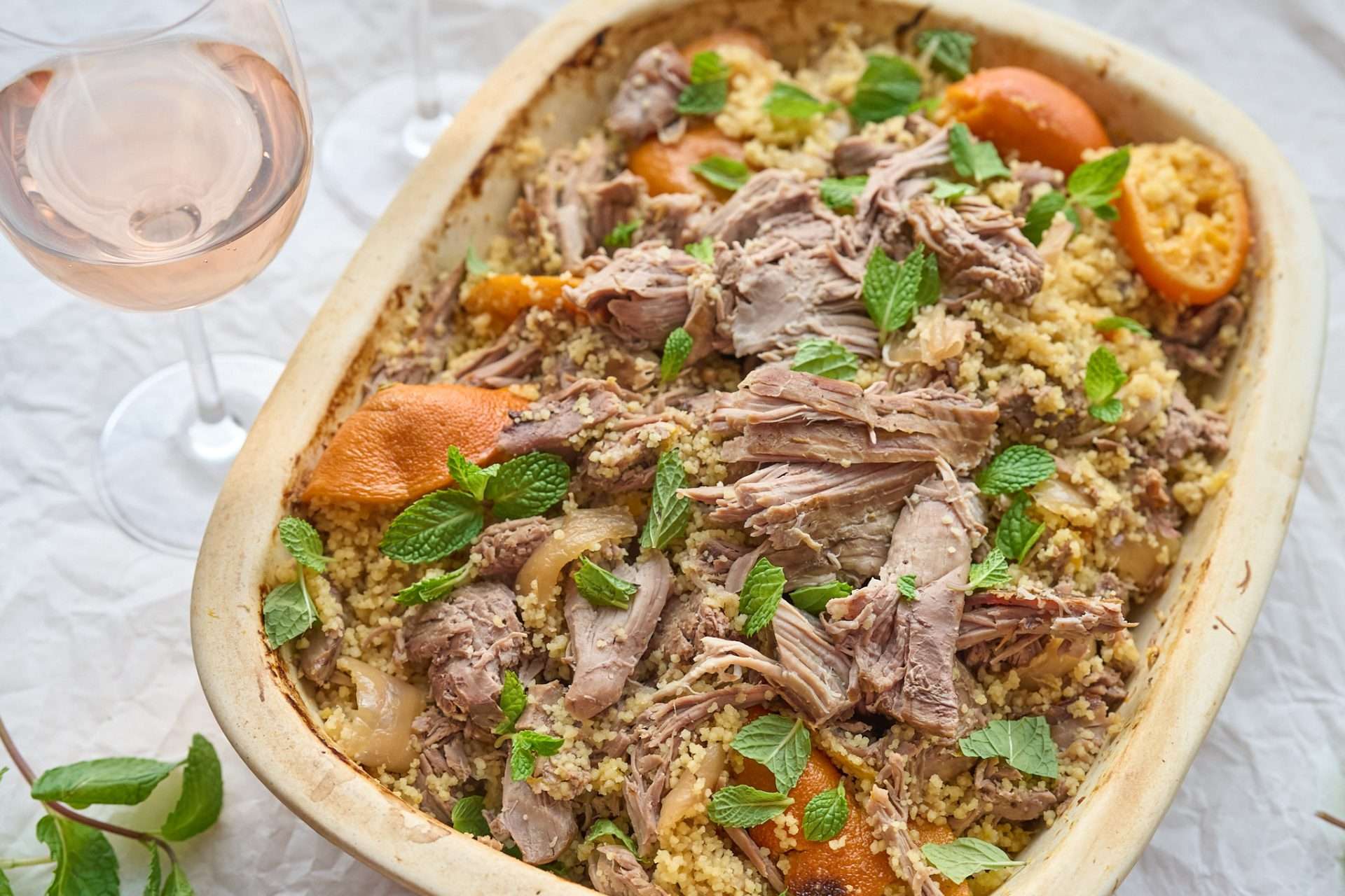 Citrus and rosé braised American lamb slow cooked until tender in a flavorful citrus infused sauce