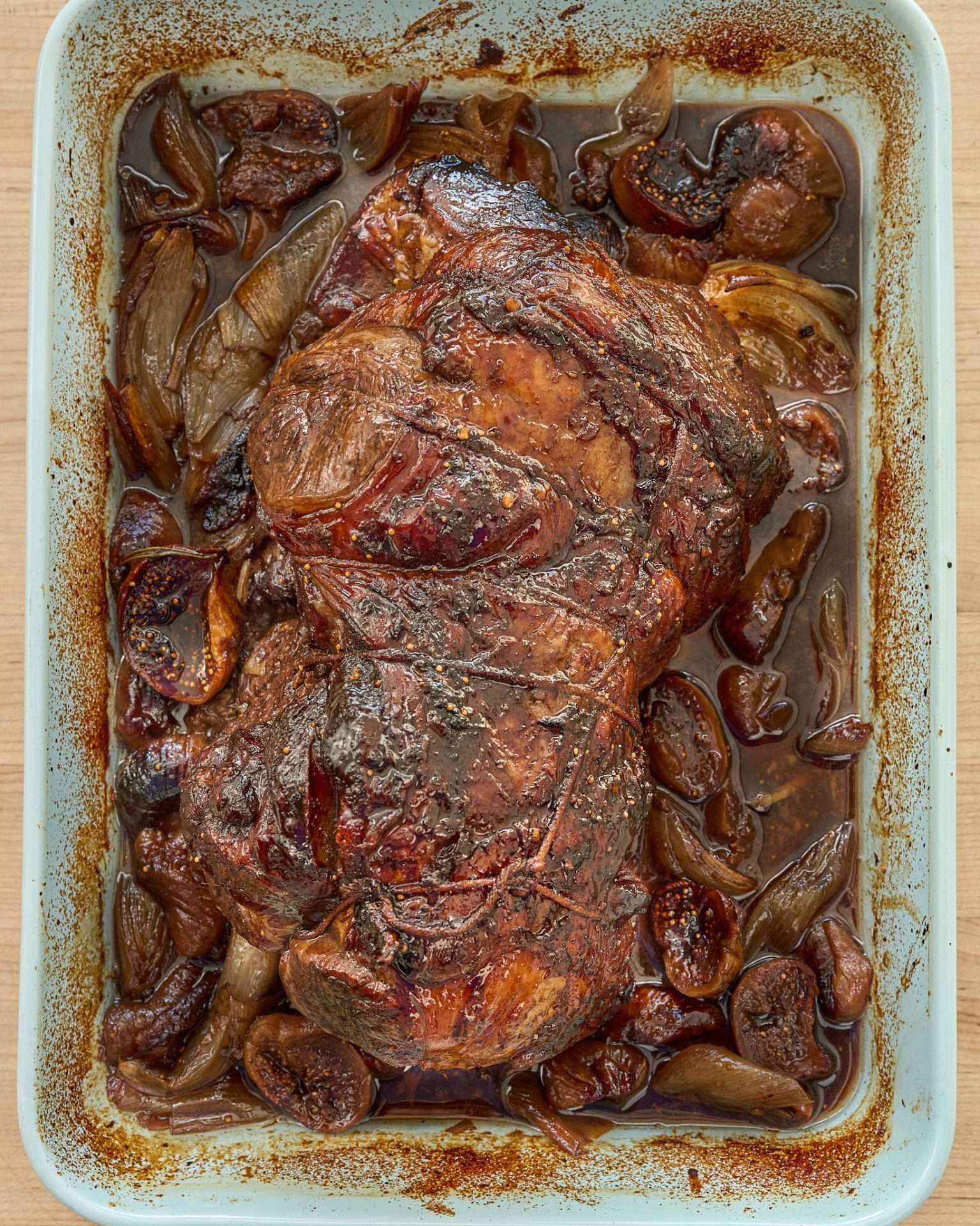 Sliced balsamic glazed leg of American lamb with roasted figs, shallots, and fresh rosemary